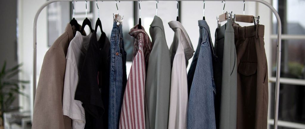 How much should I spend on essential clothing items?