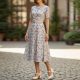 Woman wearing ivory Mary Jane heels with a floral midi dress for a vintage look