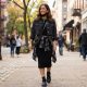 Woman styling black sneakers with a casual outfit